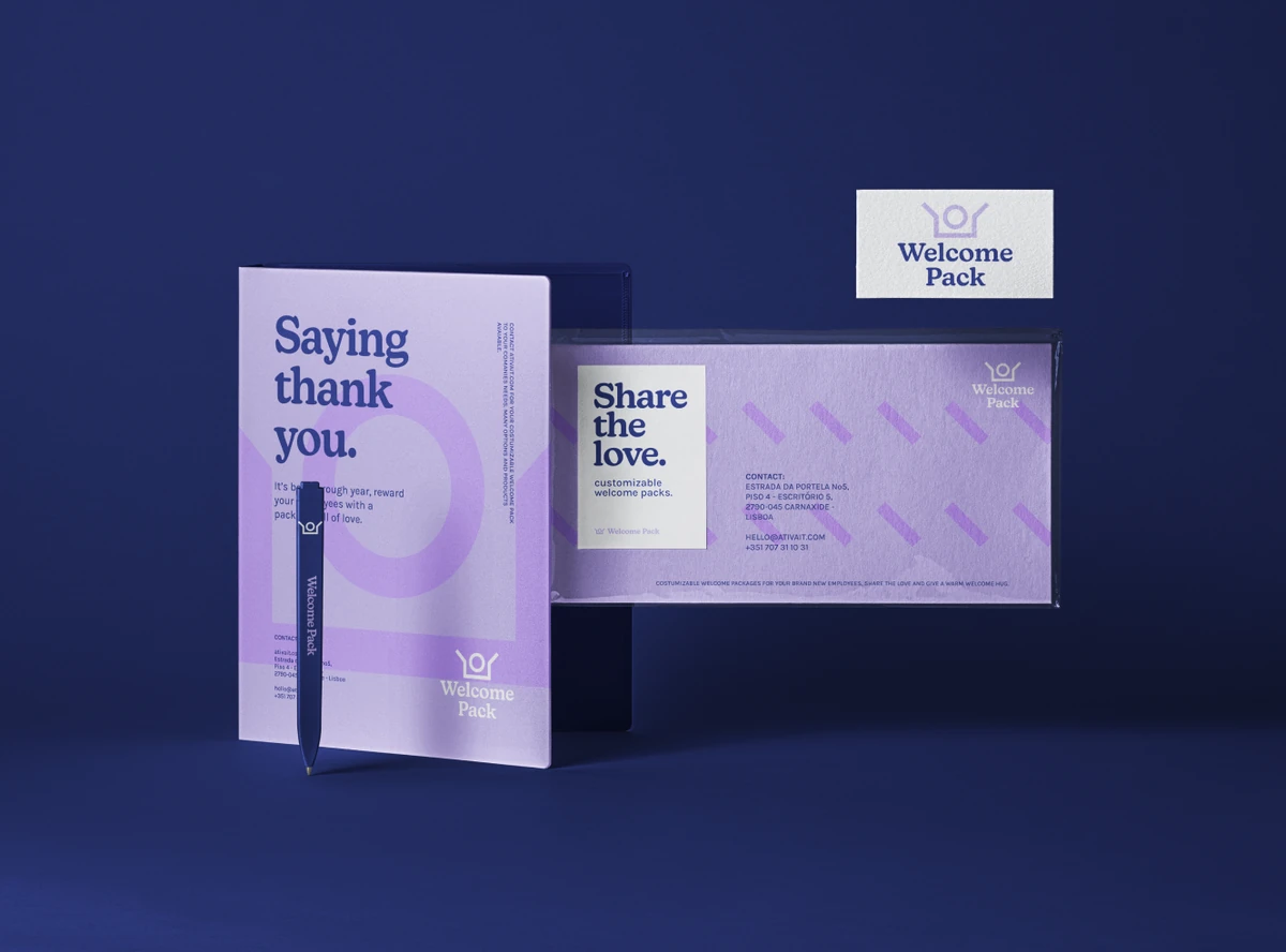 Welcome Pack stationery: card, envelope, pen and business card on dark blue